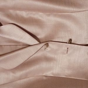 Evening satin looking jacket.  Intricate stones and sequins around double lapel